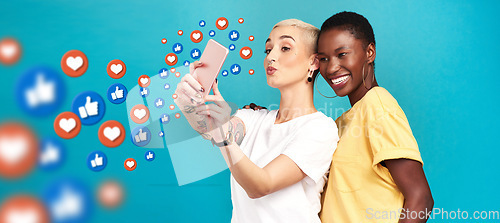 Image of Diversity, social media icons or women take a selfie for content or online post on blue background. Love emojis, friends or happy girls take fun pictures together on mobile app or network in studio