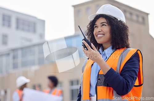 Image of Construction worker, woman with walkie talkie and communication, engineering and architect at work site. Inspection, technology and happy female contractor, building industry and labor outdoor