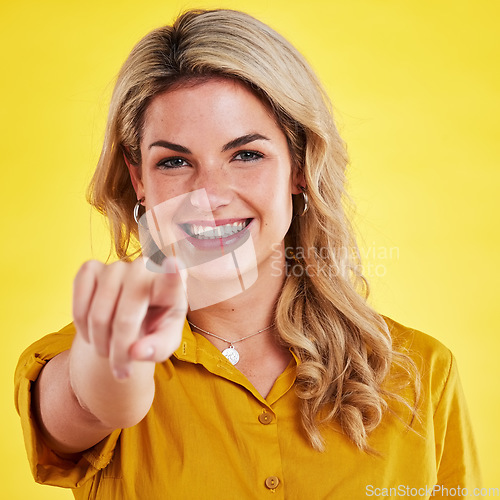 Image of Recruitment, happy and portrait of a woman pointing finger isolated on a yellow background in a studio. Smile, hiring choice and an hr manager with a gesture for a decision, support and opportunity