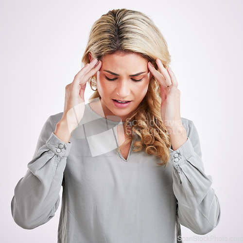 Image of Stress, anxiety and woman in studio with headache, brain fog and pain against grey background. Migraine, depression and female suffering from problem, vertigo and burnout, frustrated and tired
