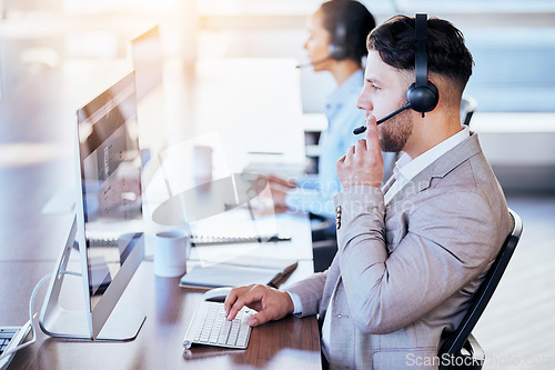 Image of Call center, computer and consulting with man in office for customer service, technical support or help desk. Telemarketing, contact us and communication with employee for legal advice and talking