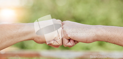 Image of Closeup of people, hands and fist bump for success, teamwork and greeting outdoors. Friends, community and bumping hand for collaboration, motivation and trust of solidarity, support and cooperation