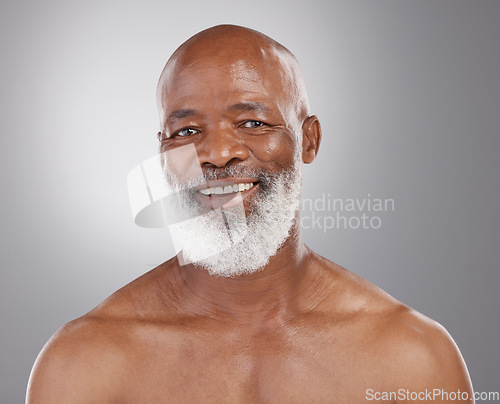 Image of Senior, skincare and portrait of black man in studio for beauty, grooming and wellness on grey background. Face, smile and happy elderly male model relax and excited for body care, results and pamper