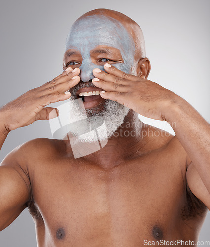 Image of Cosmetics, skincare and man with face mask, beauty and grooming against a studio background. Senior male, elderly person and happy guy with morning routine, treatment and clear skin with dermatology