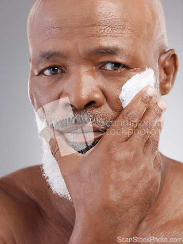 Image of Beauty, cream and portrait of senior black man for wellness, skincare and facial care in studio. Dermatology, wellness and serious male person with lotion for anti aging, wrinkle and face moisturizer