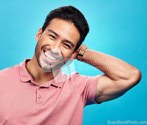 Image of Smile, happy and portrait of Asian man on blue background with pride, confidence and happiness. Fashion, confident and face of isolated male in studio with style, relaxing and excited expression