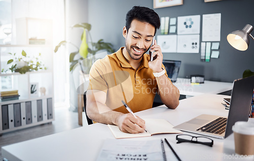 Image of Phone call, happy and Asian man writing notes for reminder, schedule and planning at office desk. Communication, business and male worker on smartphone talking, in discussion and consulting for help