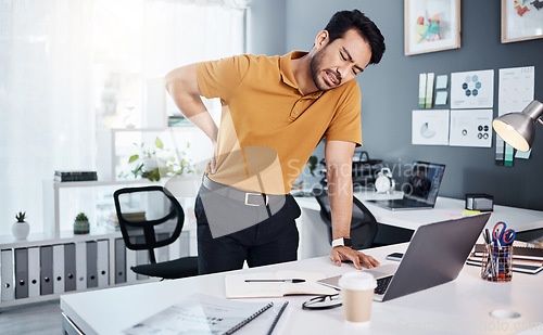 Image of Back pain, business man and stress at office desk with an injury and depression. Asian male entrepreneur frustrated with body ache, mental health and burnout or fatigue problem and tired of working