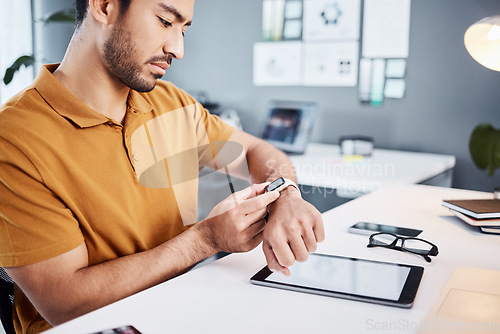 Image of Time check, notification and businessman with a watch at work for a project deadline or schedule. Technology, office and an Asian employee setting a timer, reading a message or communication on tech