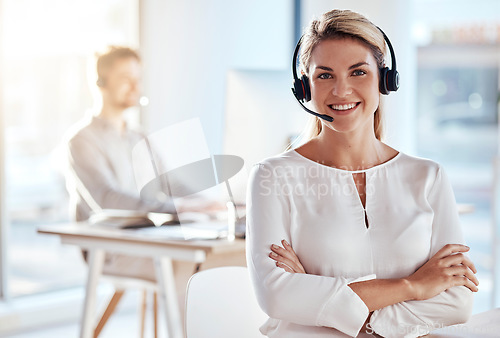 Image of Portrait, customer support and smile with a woman consultant working in her office for after sales service. Call center, contact us and crm with a young female employee consulting using a headset