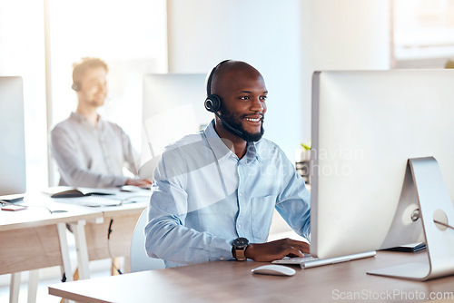 Image of Call center, computer and online with black man in office for customer service, technical support and advice. Technology, contact us and communication with employee operator in help desk agency