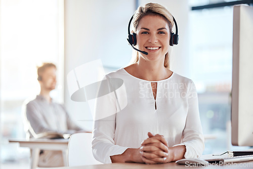 Image of Portrait, customer service and happy with a woman consultant working in her office for after sales support. Call center, contact us and crm with a young female employee consulting using a headset