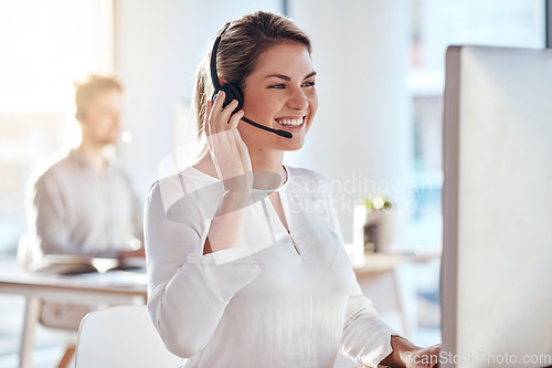 Image of Call center, computer and friendly with woman in office for customer service, technical support and advice. Technology, contact us and communication with employee operator in help desk agency