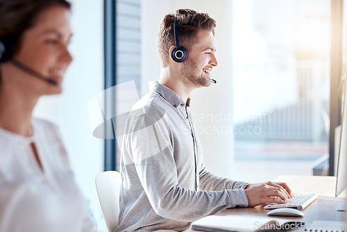 Image of Call center, computer and consulting with man in office for customer service, technical support and advice. Technology, contact us and communication with employee operator in help desk agency