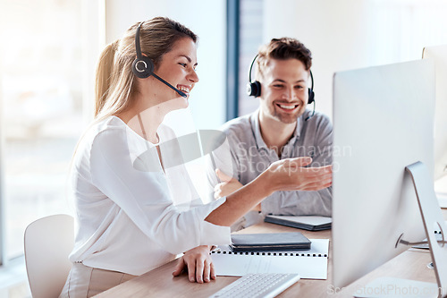 Image of Computer, collaboration and call center with a team consulting while working in customer service for support. Teamwork, crm or contact us with man and woman consultant employees at work in an office