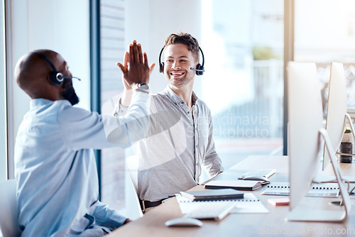 Image of Call center team, men high five and computer with support and success, people make telemarketing sale and collaboration. Contact us, CRM and coworking with communication, teamwork and celebrate