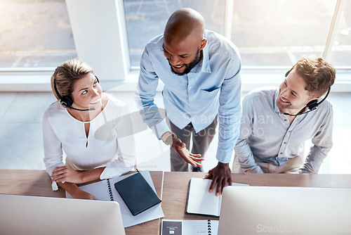 Image of Call center employees in customer service training, help and business people working together with support. Contact us, CRM and coworking top view with teaching and learning, coaching and team leader