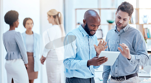 Image of Collaboration, tablet and planning with business men talking in the office while discussing strategy. Teamwork, online and project management with a corporate team chatting about company mission