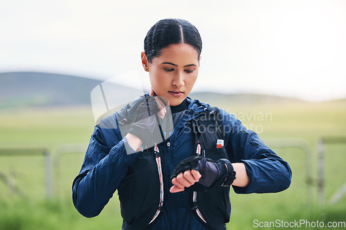 Image of Heart rate, time and woman in the countryside ready for fitness and exercise checking pulse. Sports, training and smart watch of a female athlete looking at workout app for health and wellness