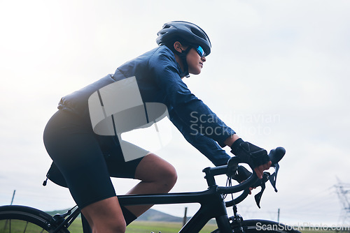 Image of Woman, bicycle athlete and cycling on sky mockup outdoor, exercise and training for triathlon. Female cyclist, bike and fitness for sports marathon, cardio power and performance action of competition