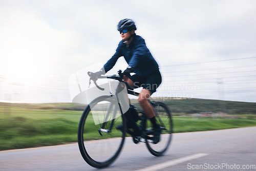Image of Woman, bicycle and nature road with motion blur for fitness, health and eco friendly travel on summer adventure. Cycling girl, bike and fast at workout, training and journey on countryside street