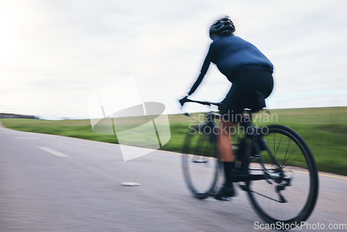 Image of Person, bicycle and cycling on motion blur, sky mockup and countryside road for triathlon from behind. Cyclist, bike and speed for sports training, cardio performance and power for competition race