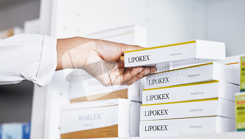 Image of Doctor, hands and drugs from shelf for healthcare illness, pain or relief of medication at pharmacy. Hand of medical professional holding pharmaceutical products for inventory or packing at clinic