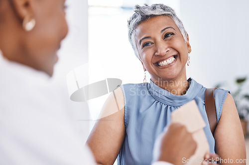 Image of Happy, medical and a woman customer in a pharmacy for medicine, talking to a professional consultant. Smile, healthcare and a mature female patient chatting to a pharmacist in a clinic or dispensary