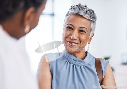 Image of Happy, healthcare and a woman customer in a pharmacy for medicine, talking to a professional consultant. Smile, medical and a mature female patient chatting to a pharmacist in a clinic or dispensary