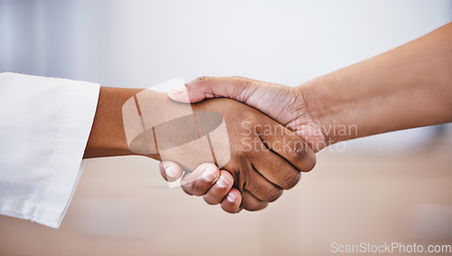 Image of Doctor, handshake and meeting in thank you for healthcare, agreement or deal at hospital. Medical professional shaking hands with patient for healthy wellness, consultation or partnership at clinic