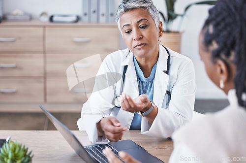 Image of Doctor, laptop and woman consulting results, healthcare prescription or medicare diagnosis at desk. Senior female medical expert in consultation, research or health advice on computer at clinic