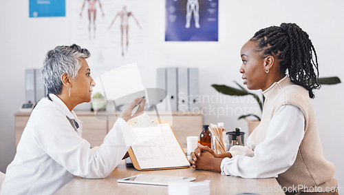 Image of Consulting, life insurance and doctor with black woman in office for medical, checklist and results. Interview, healthcare and medicine with patient and expert in hospital for exam, help or advice