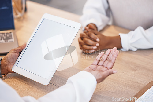 Image of Doctor, hands and mockup tablet for consulting, Telehealth or healthcare with patient on office desk at hospital. Hand of medical professional in consultation with client holding technology display