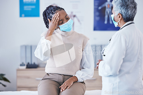 Image of Consultation, doctor and patient with face mask, headache and covid healthcare advice at clinic. Black woman consulting medical professional, health care check and faq, pain info and help at hospital