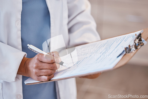 Image of Doctor, woman hand and clipboard with pen and consultant contract for insurance document. Hospital, clinic and healthcare worker with writing and paperwork for report and surgeon application