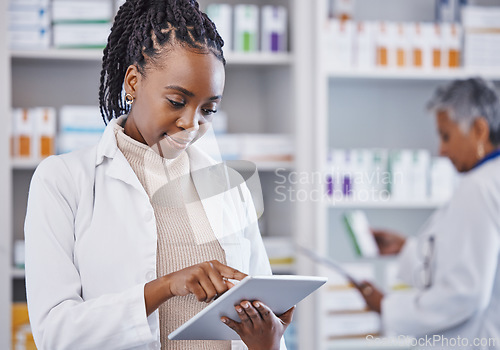 Image of Black woman, doctor and tablet for inventory inspection at pharmacy for healthcare, medication or prescription stock. African female medical expert checking data or research on technology at clinic