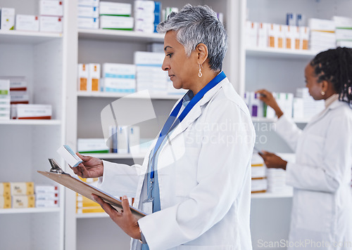 Image of Woman, doctor and inventory inspection at pharmacy for healthcare, medication or prescription stock. Female medical expert checking and reading pharmaceutical products, pills or drugs at the clinic