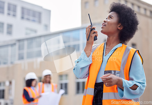 Image of Construction worker, black woman with walkie talkie and inspection of work site, engineering and architecture. Communication, technology and female contractor, building industry and labor outdoor