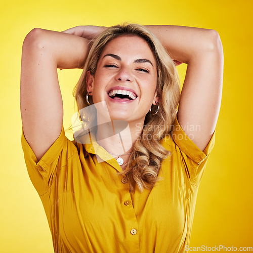 Image of Happy fashion, confident and portrait of a woman isolated on a yellow background in a studio. Laughing, beautiful and a clothing model with a smile in a shirt, confidence and happiness while posing