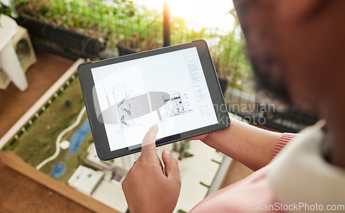 Image of Hands, tablet and architecture design with blueprint, model and planning for property development at startup. Architect, typing and touchscreen for buildings, civil engineering or app for real estate