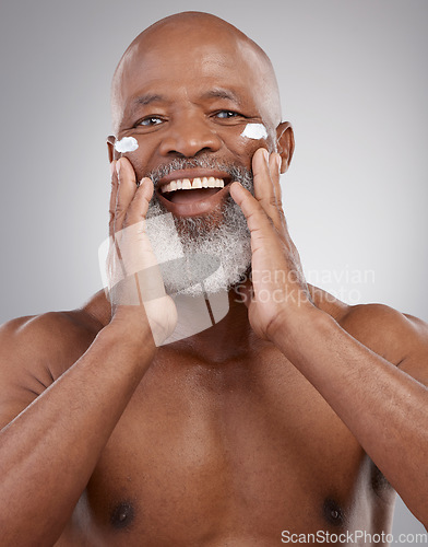 Image of Skincare cream, face and portrait of old man for wellness, cosmetics and facial on studio background. Dermatology, beauty and happy male model apply anti aging lotion, wrinkle product and moisturizer