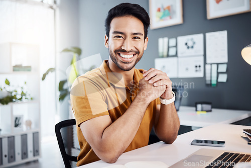 Image of Smile, confidence and portrait of a man in the office while working on a business project with a laptop. Happy, success and professional Asian male corporate employee sitting by his desk in workplace