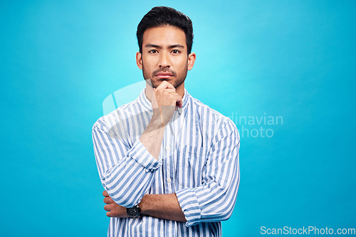 Image of Portrait of man with focus, blue background and thinking of ideas with serious face isolated on studio backdrop. Confidence, mockup space and professional male model with pride and vision for future.