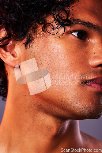 Image of Face, beauty and man model jaw with skincare, self care and smooth skin isolated in a gray studio background. Head, Latino and serious male person with cosmetic, dermatology and facial treatment