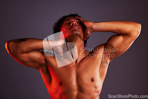 Image of Light, relax and man profile in a studio with art lighting and creative thinking with muscles. Art, isolated and gray background of an attractive male model with artistic, sensual and posing