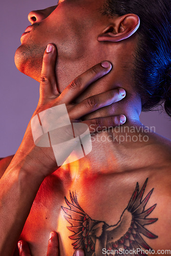 Image of Beauty, skincare and hands on neck of man for cosmetics, self care and grooming on studio background. Creative aesthetic, neon glow and closeup of male model for healthy skin, wellness and makeup