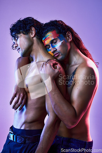 Image of Friends, men and art model for beauty creativity with body paint as artwork isolated in a purple studio background. Colorful, embracing and creative people for artistic beauty, lgbt and fashion