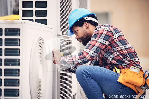 Image of Black man, electrician and maintenance on air conditioner with engineering and handyman working with tools on roof. AC repair, professional male technician outdoor and power generator with service