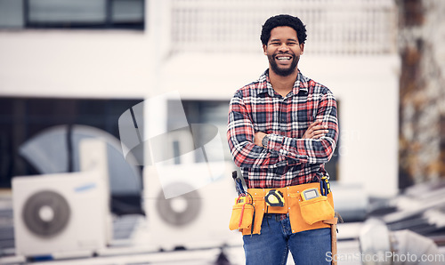 Image of Engineering, portrait and man arms crossed on roof air conditioning, maintenance and technician ac repair. Happy African person, handyman or electrician contractor for aircon or electricity service