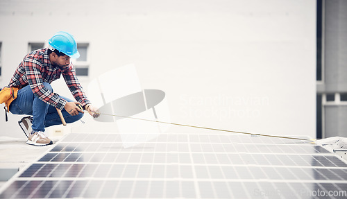 Image of Man, solar panel and tape measure for roof maintenance of photovoltaic plate, eco friendly sustainable grid or renewable energy. Inspection, green power supply or male engineer check electricity cell